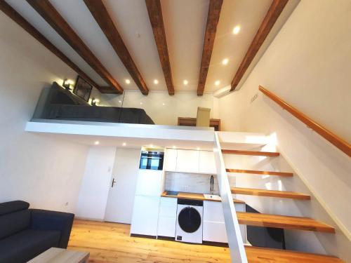 a living room with a staircase in a house at Mezzanine de Grinzing in Vienna