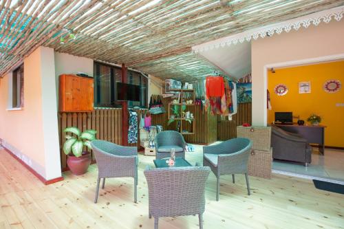 a room with chairs and tables in a store at Casa De Leela Self Catering Guest House in La Digue