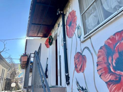 a house with flowers painted on the side of it at Casa Palazzo Civitanova in Civitanova del Sannio