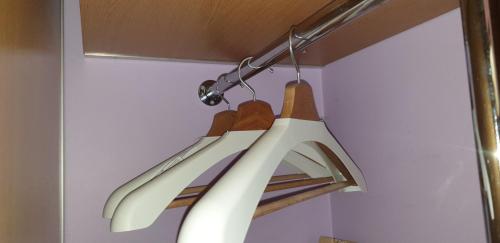 a light fixture hanging from a ceiling in a room at Metropolia Apartments in Rīga