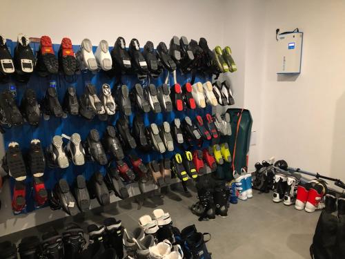 a bunch of shoes are lined up on a wall at Apartmán Vila Zuberec in Zuberec