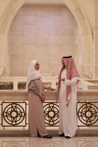two women standing in front of a church at Makkah Clock Royal Tower, A Fairmont Hotel in Makkah