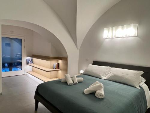 Ένα ή περισσότερα κρεβάτια σε δωμάτιο στο La Suite di Piazza dell'Università