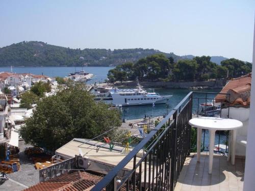 a cruise ship is docked in a harbor at nostalgo in Skiathos Town