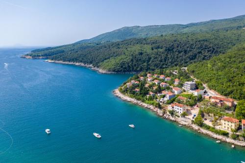 an aerial view of a small island in the water at House 61 Sveta Marina in Sveta Marina