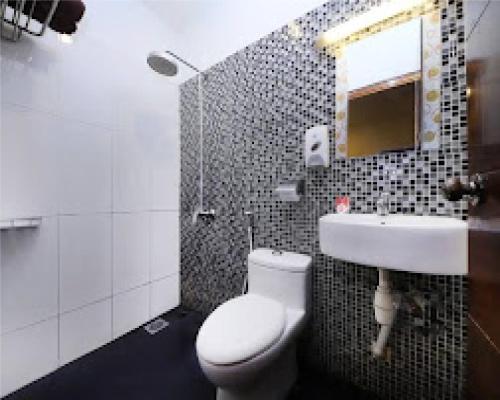 a bathroom with a toilet and a sink at GOLDEN PALACE in Kuala Lumpur