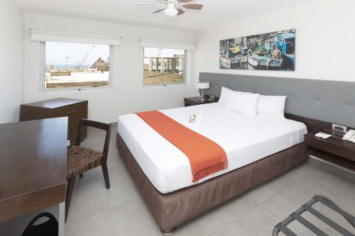 En eller flere senge i et værelse på Casa Andina Standard Talara