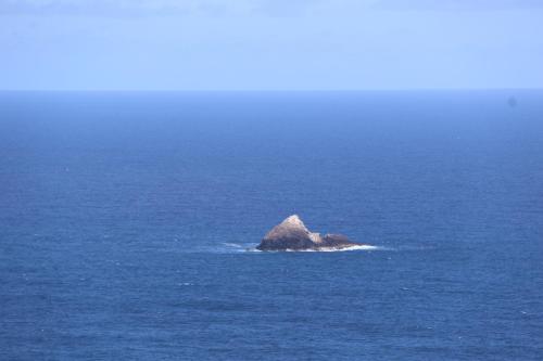 a small island in the middle of the ocean at Le Colibri et le Frangipanier in La Trinité