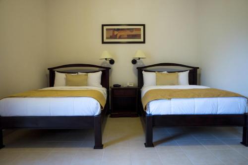 Hotel Real La Mercedにあるベッド