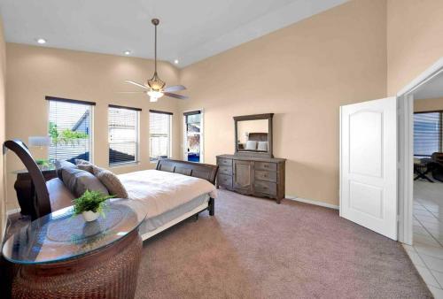 a bedroom with a bed and a table in a room at Private house in N Scottsdale in Cave Creek