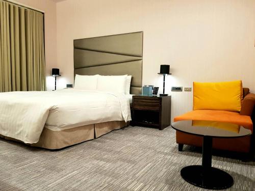 Ein Bett oder Betten in einem Zimmer der Unterkunft Hotel Geight Taipei