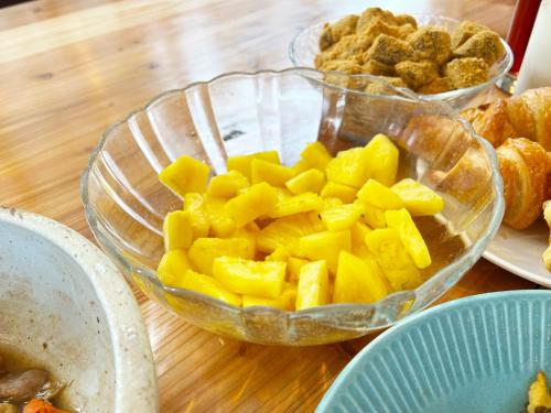 a table with two bowls of fruit and other food at Hotel Abest Naha Kokusai Street in Naha