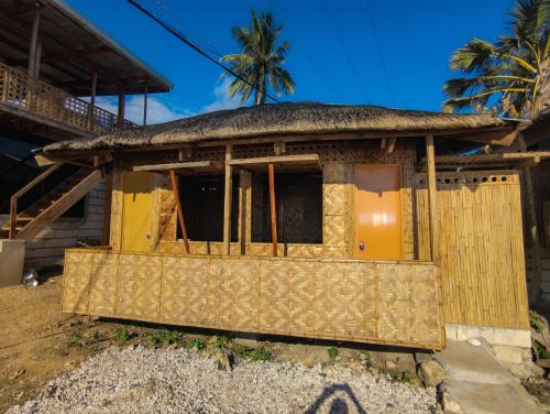 a house with a thatched roof at Truth be Found Ministry Resort in Jagna