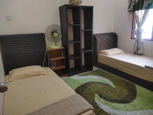 Postel nebo postele na pokoji v ubytování Zulkifli Homestay Tambun,Ulu kinta,Tg Rambutan