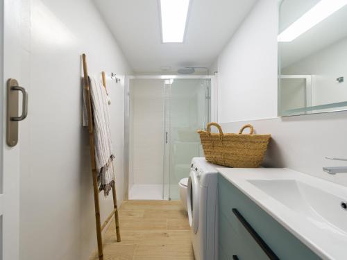 a bathroom with a sink and a toilet at Arena y Calma Jandia con aire acondicionado in Morro del Jable
