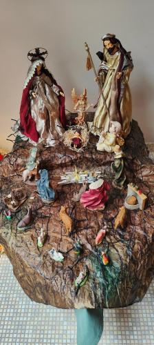 a table with a bunch of figurines on it at Relais Villa Annamaria Bed end Breakfast in Istrana