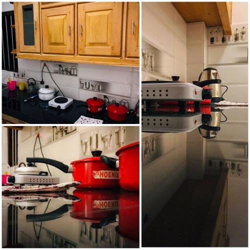 a kitchen with a stove with pots and pans at Spring Cottage (02) in Weligama