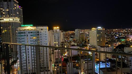 a view of a city at night with buildings at PANORAMA Condotel by HLG in Nha Trang