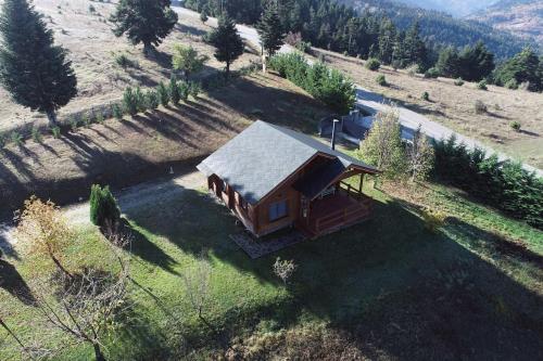 an aerial view of a small house in a field at The Flysch in Miríki
