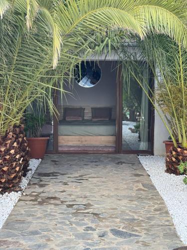 a bed in a room with some plants at B&B Casa Loré D'or in Alora