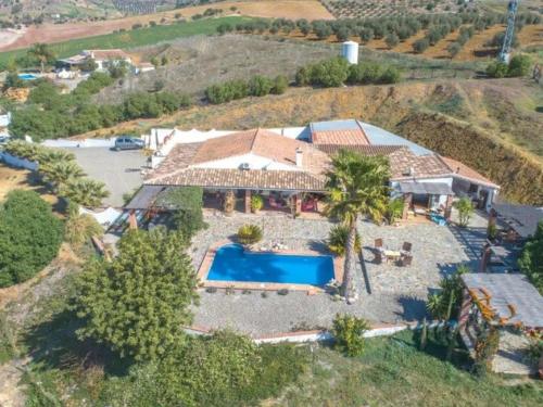 an aerial view of a house with a swimming pool at B&B Casa Loré D'or in Alora