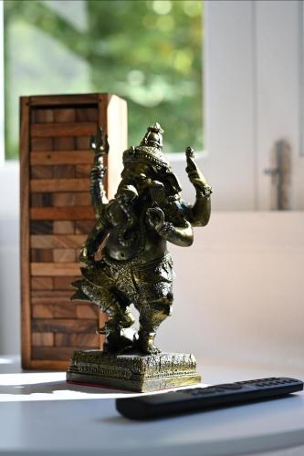 a bronze statue of an elephant on a table at Bao Village in Haad Yao