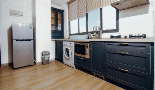 Kuchyň nebo kuchyňský kout v ubytování Tanzanite Serviced Apartment - TSA Masaki
