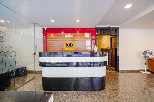 a lobby with a ticket booth in a building at FabHotel Greenwood Xpress Inn - Nr Manipal Hospital in Bengaluru