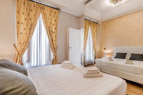 Postel nebo postele na pokoji v ubytování APT ROME - Pietra