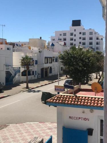 a view of a city street with white buildings at Residence Mediterranee in Martil