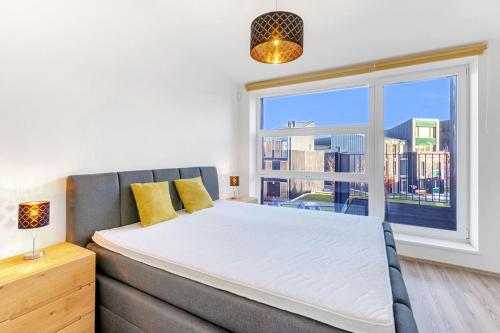 Postel nebo postele na pokoji v ubytování Miky Apartmán Klínovec Garden