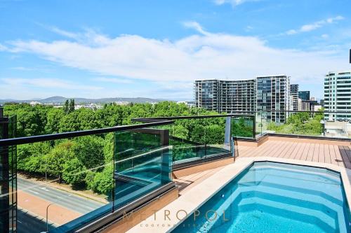 a balcony with a swimming pool on top of a building at Splendid 2bd 1bth 1csp Apt - Superb CBD Location in Canberra