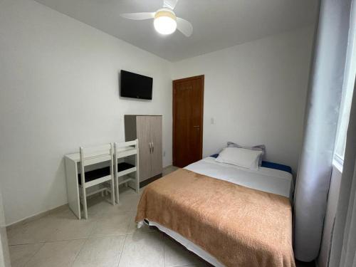 Ένα ή περισσότερα κρεβάτια σε δωμάτιο στο Apartamento Onda Azul