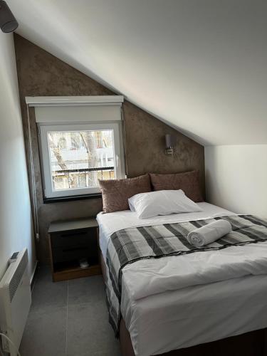 Ένα ή περισσότερα κρεβάτια σε δωμάτιο στο Ortak Apartments