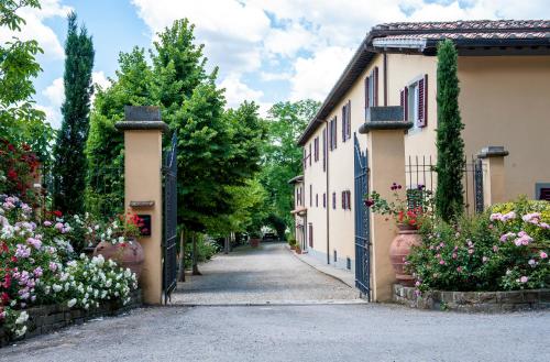 a street in a village with flowers at Agriturismo Fattoria Lavacchio in Pontassieve