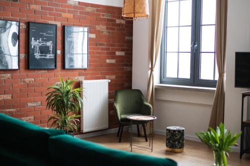 Televízia a/alebo spoločenská miestnosť v ubytovaní RedCity LOFT 303