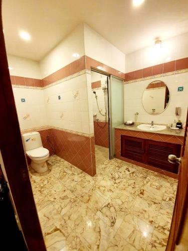 a bathroom with a toilet and a sink and a shower at Raya Ville in Amphoe Koh Samui