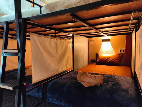 Postel nebo postele na pokoji v ubytování Stay At Moon Hostel Haad Rin