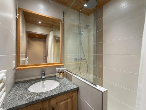 a bathroom with a sink and a shower at Charmant appartement cosy au centre de Val Thorens avec WiFi - FR-1-640-20 in Val Thorens