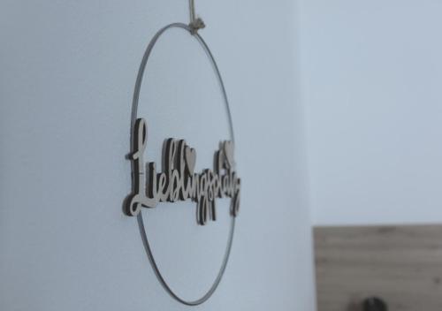 a mirror hanging on a wall with the words i hate myself at Apartment VIERSTERNE in Neustift im Stubaital
