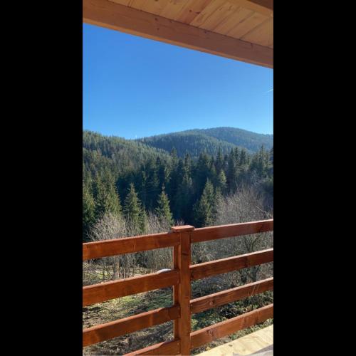 a view of the mountains from the porch of a house at The Tara Concept in Šljivovica