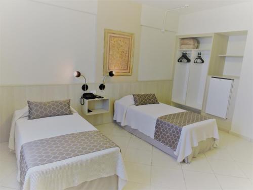 Postel nebo postele na pokoji v ubytování Hotel Binder Quality Inn