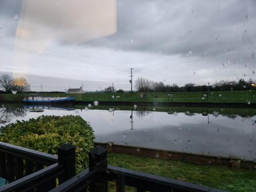 a view of a body of water with a fence at The Swan - A Colombo Edition Hotel in Ely