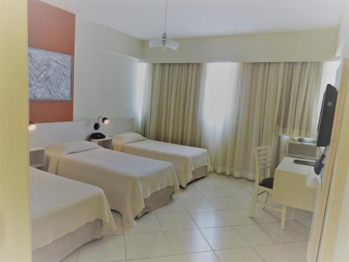 Postel nebo postele na pokoji v ubytování Hotel Binder Quality Inn