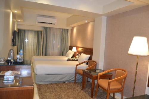 Omar El Khayam Al Minya Hotelにあるベッド
