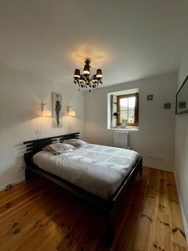 Postel nebo postele na pokoji v ubytování Gîte Les Voûtes du Chambon
