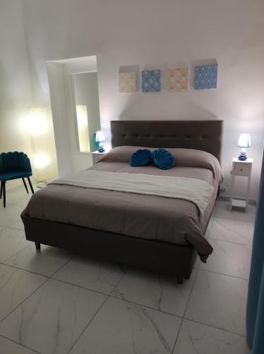 Un pat sau paturi într-o cameră la Casa della Sibilla