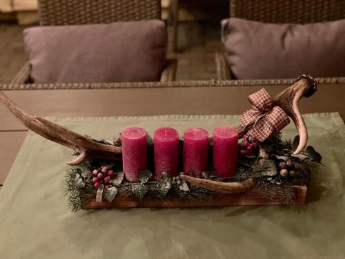 a group of pink candles on a table at Hunting Lodge Lipót in Lipót