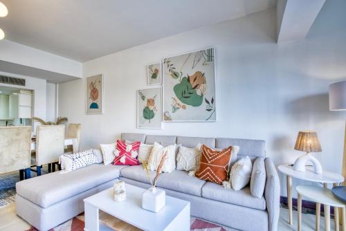 a living room with a couch and a table at LOFTS by Elegant Hospitality in Cairo