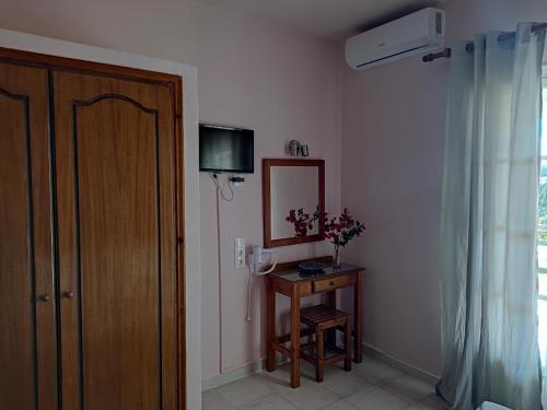 Телевизор и/или развлекательный центр в Su Casa Apartments